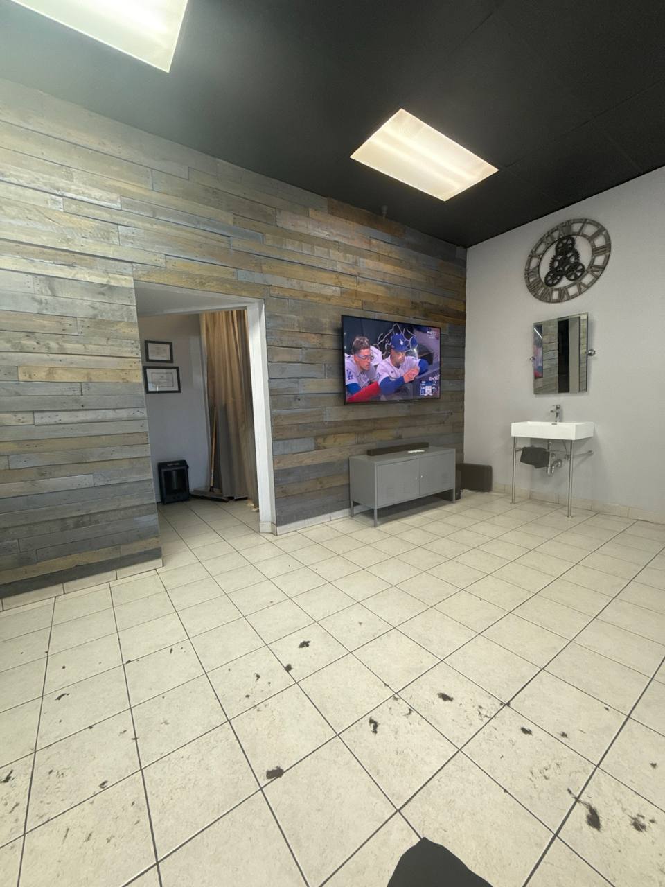 Barn wood wall and TV inside the shop